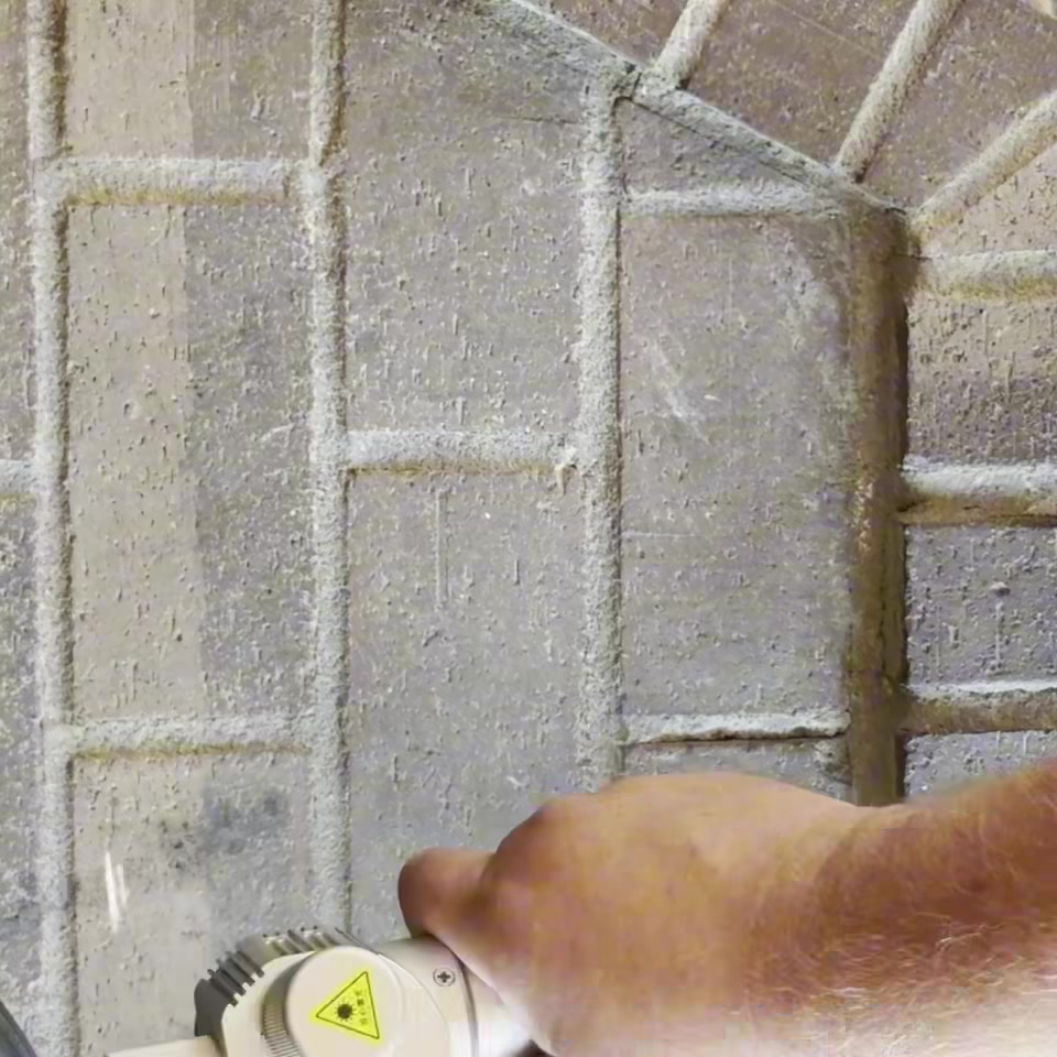 Cinderblock wall laser cleaning