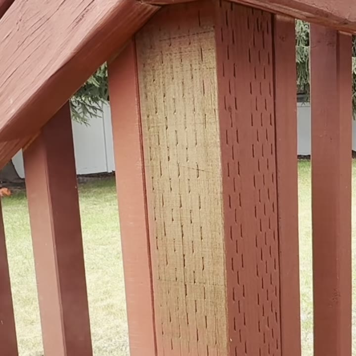 Wood fence post after laser paint stripping