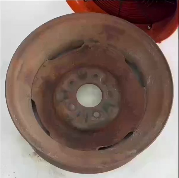 Steel wheel before — heavy rust